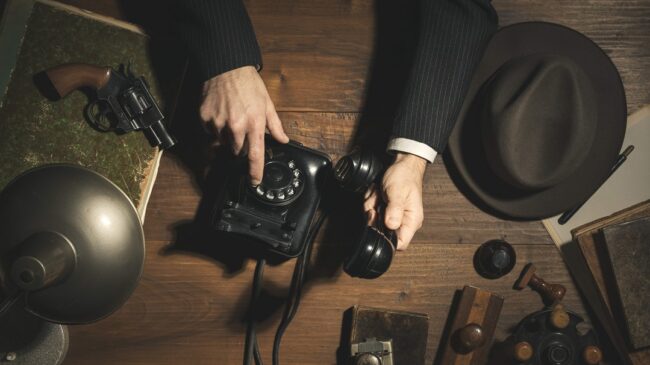 1950s style detective making a phone call at night What Is Debugging and Different Stages In Debugging By Aryaman Detective Best Debugging Detective In Kolkata