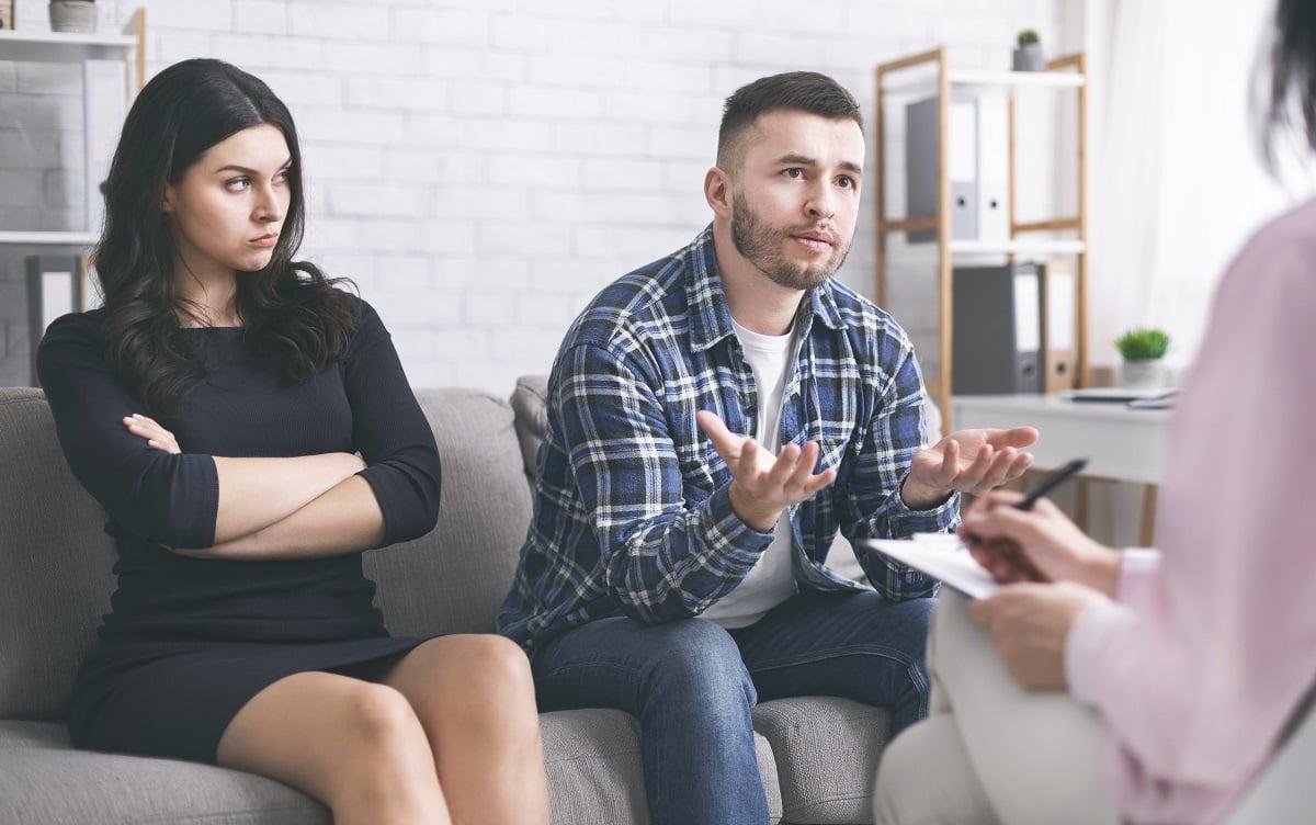 Young man talking to psychotherapist at marital consultation Unveiling the Truth: Navigating Suspicions of a Cheating Spouse ? By Aryaman Detective